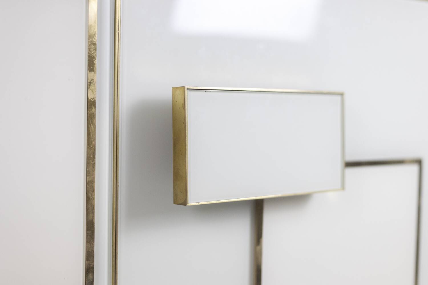 Geometric sideboard in glass and gilded brass. Contemporary Italian work.