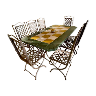 Dining table and seats for exterior or interior in metal and enameled lava tiles