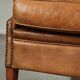 Sheepskin wingback armchair in a light cognac colour in English style