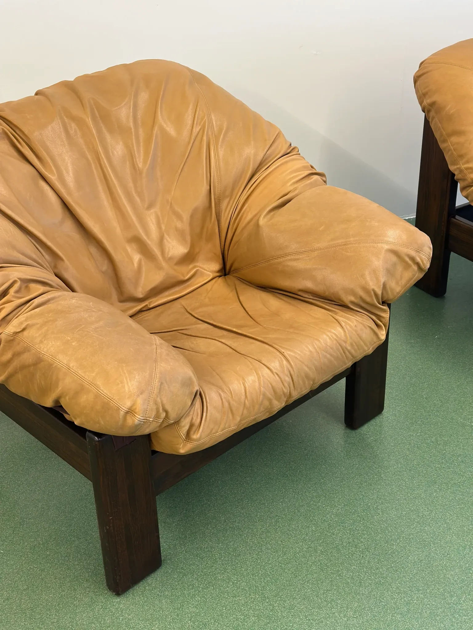 Pair of brutalist leather lounge chairs, 1960s