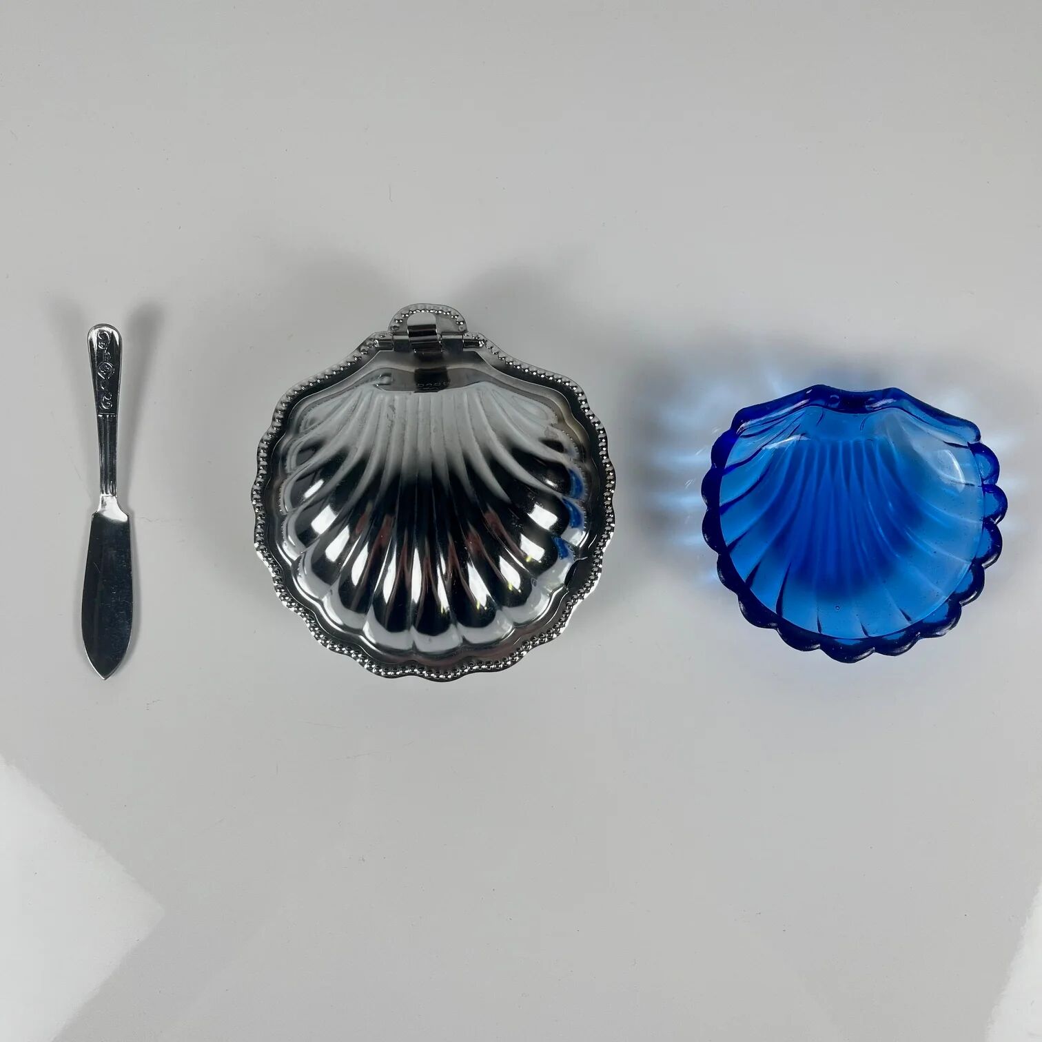 Metal shell butter dish with blue insert, 1970 with knife.