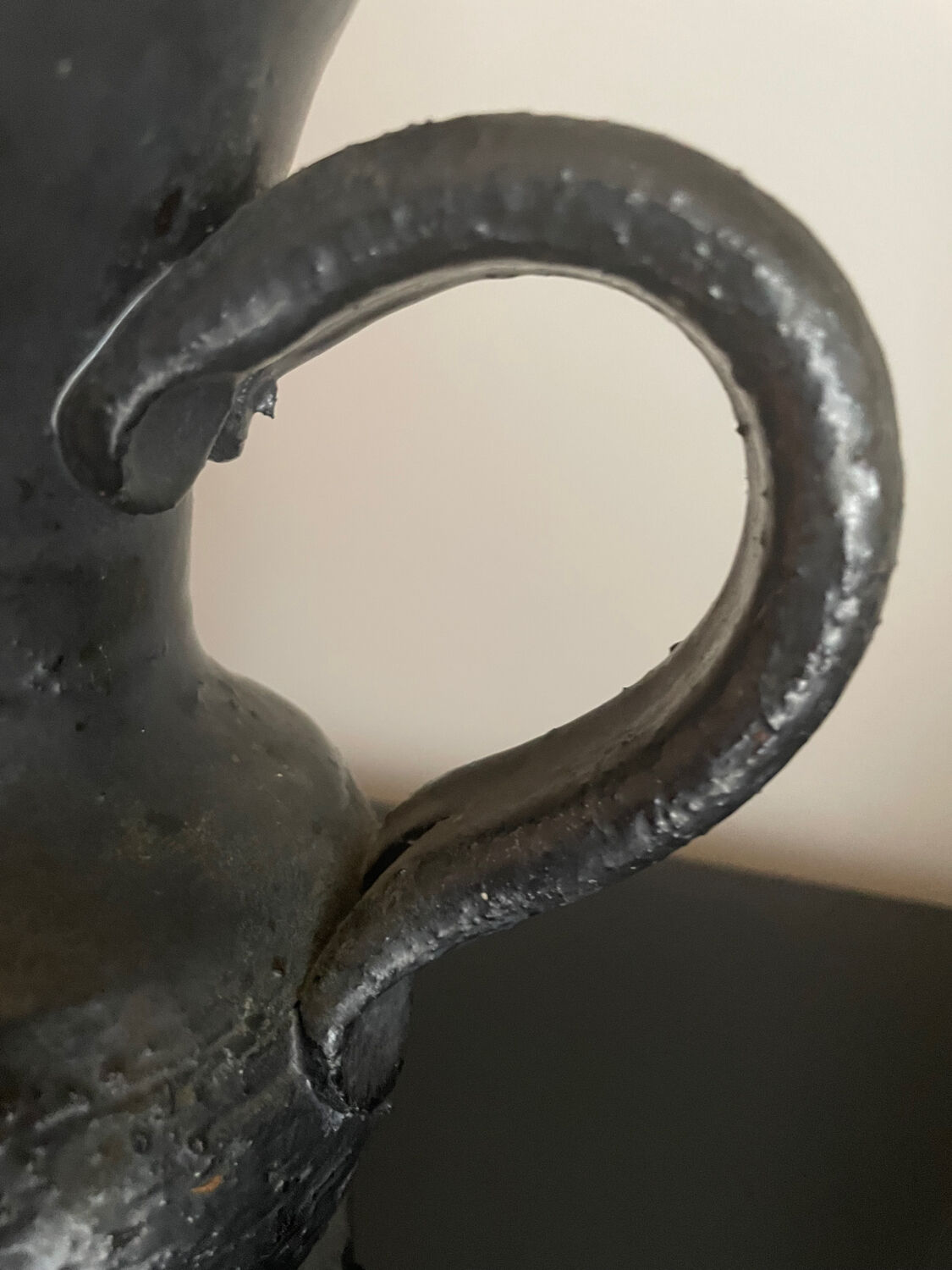 Black ceramic pitcher by Jean Marais