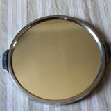 A large round mirror tray with metal handles