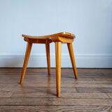 Small curved wooden stool