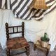 Rustic footrest made of wood and straw