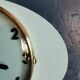Horloge formica vintage pendule murale silencieuse ovale "Cadelec bleu"