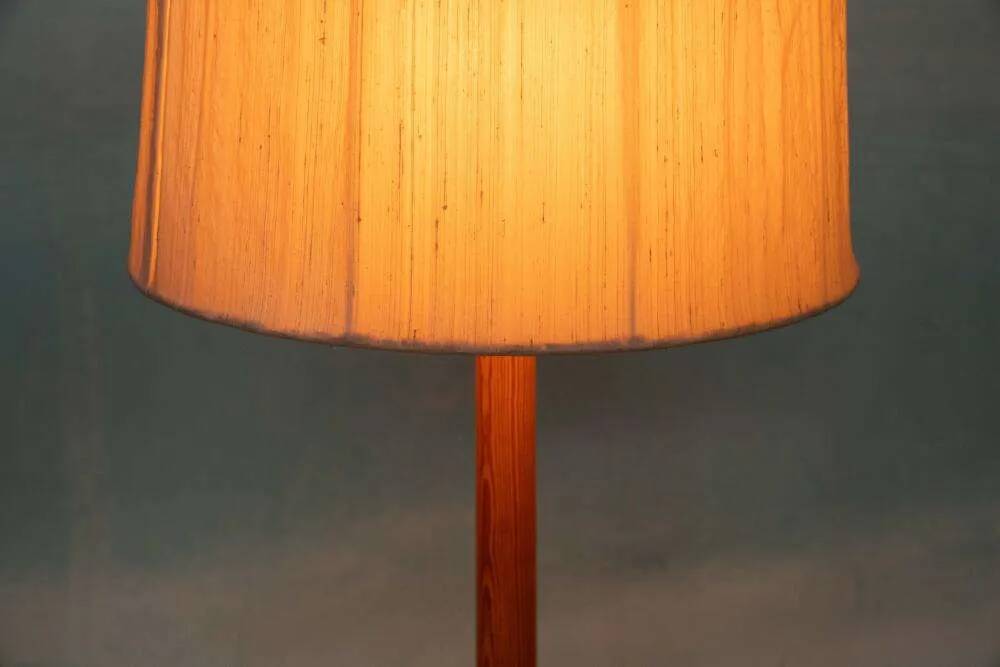Vintage Swedish wooden floor lamp with pleated shade from the 1960s.