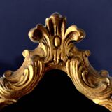 Rococo wall mirror in golden resin