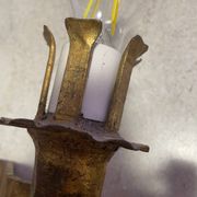 Spanish brutalist wall light in gilded wrought iron.