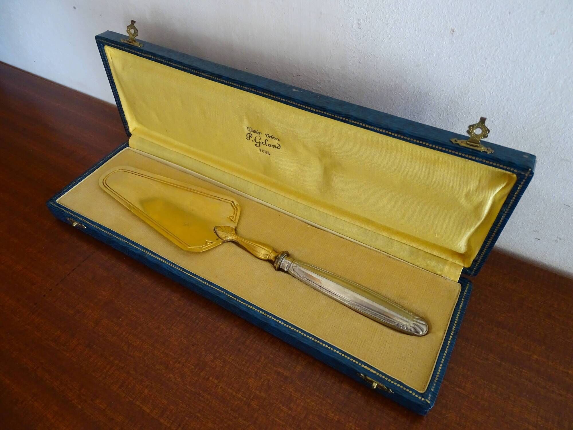Antique silver and gilded metal pie shovel in case