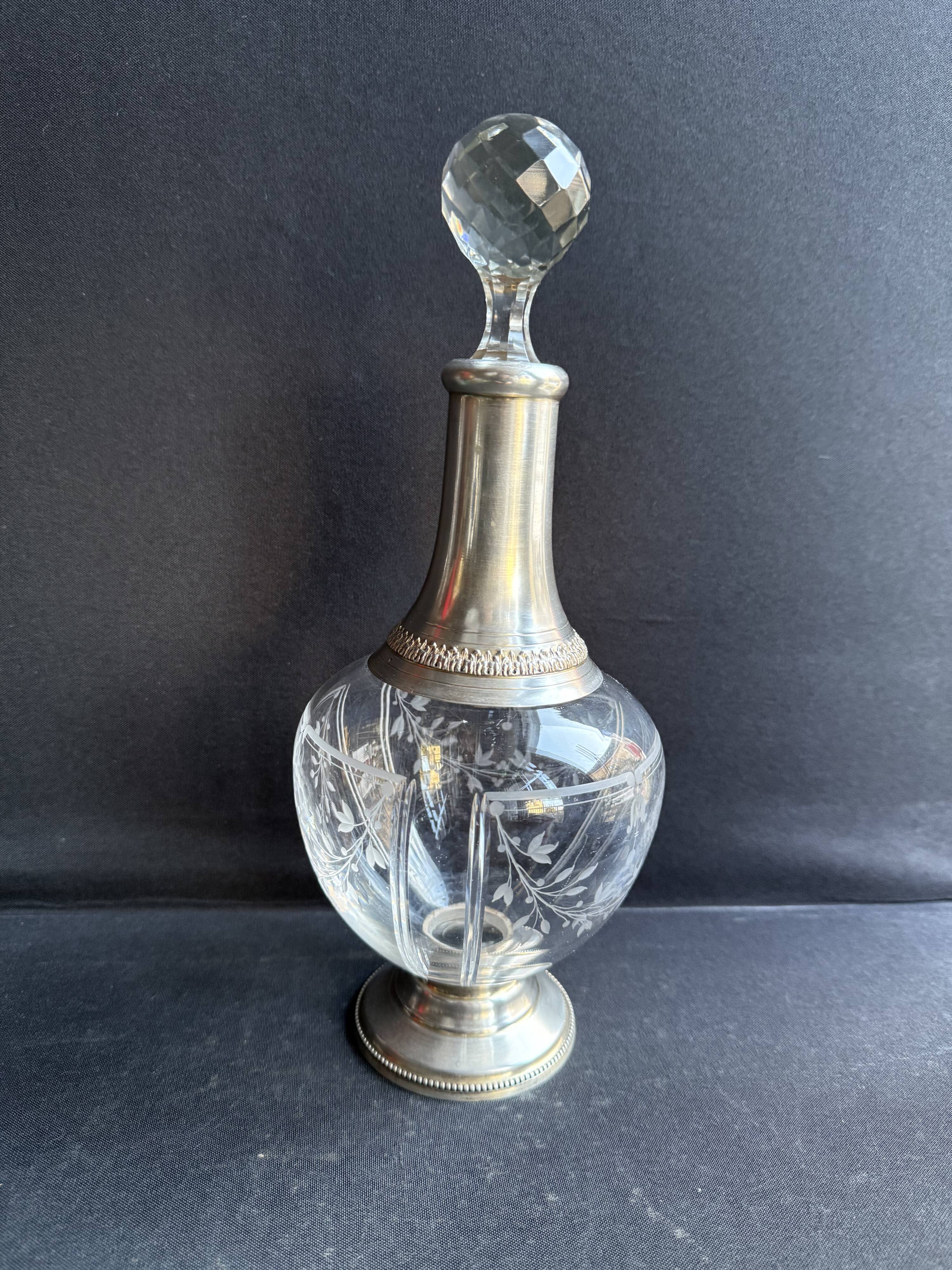 Cut crystal carafe with silver frame