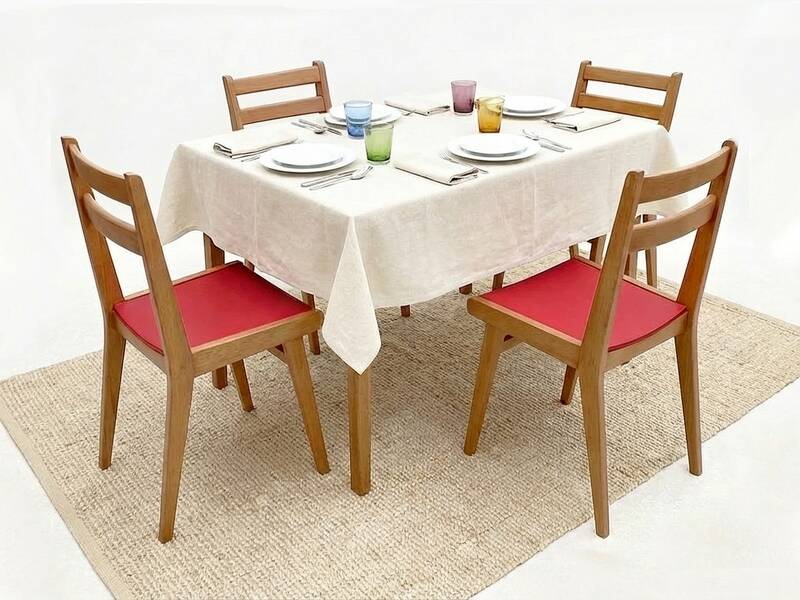 Vintage chairs from the 1950s in wood and faux leather.