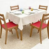 Vintage chairs from the 1950s in wood and faux leather.