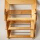 Wall-mounted magazine rack in varnished plywood, 80s/90s