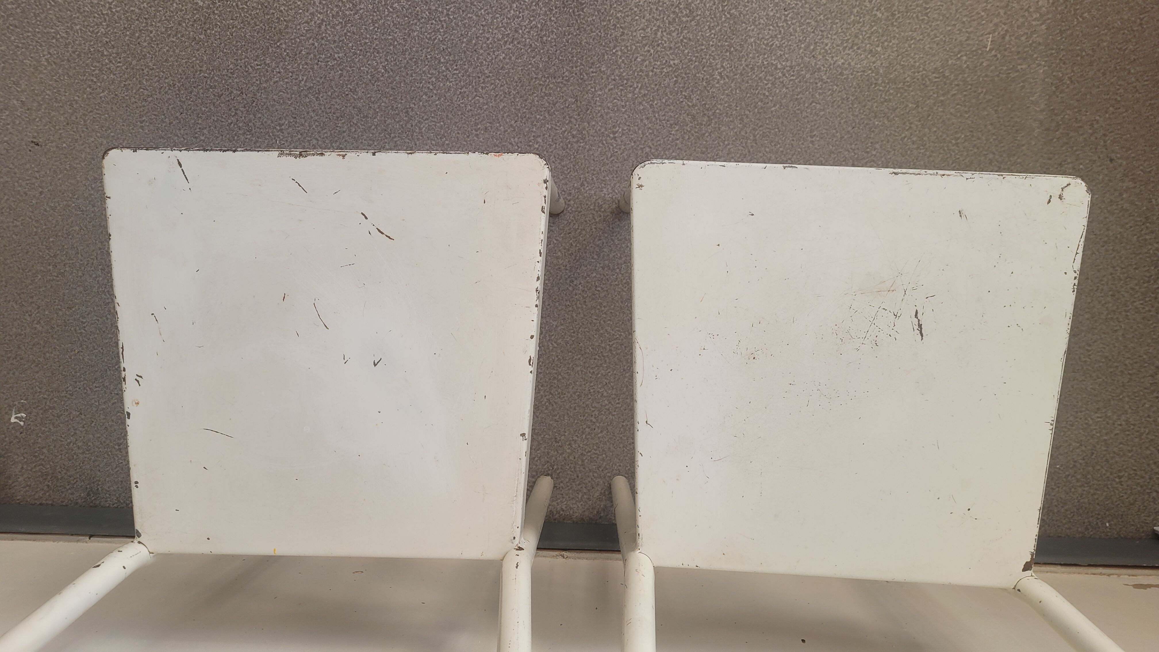 Pair of patinated white metal chairs