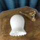White opaline shaped like a lily of the valley bell