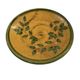 Decorative glazed terracotta plate with olive leaf pattern.