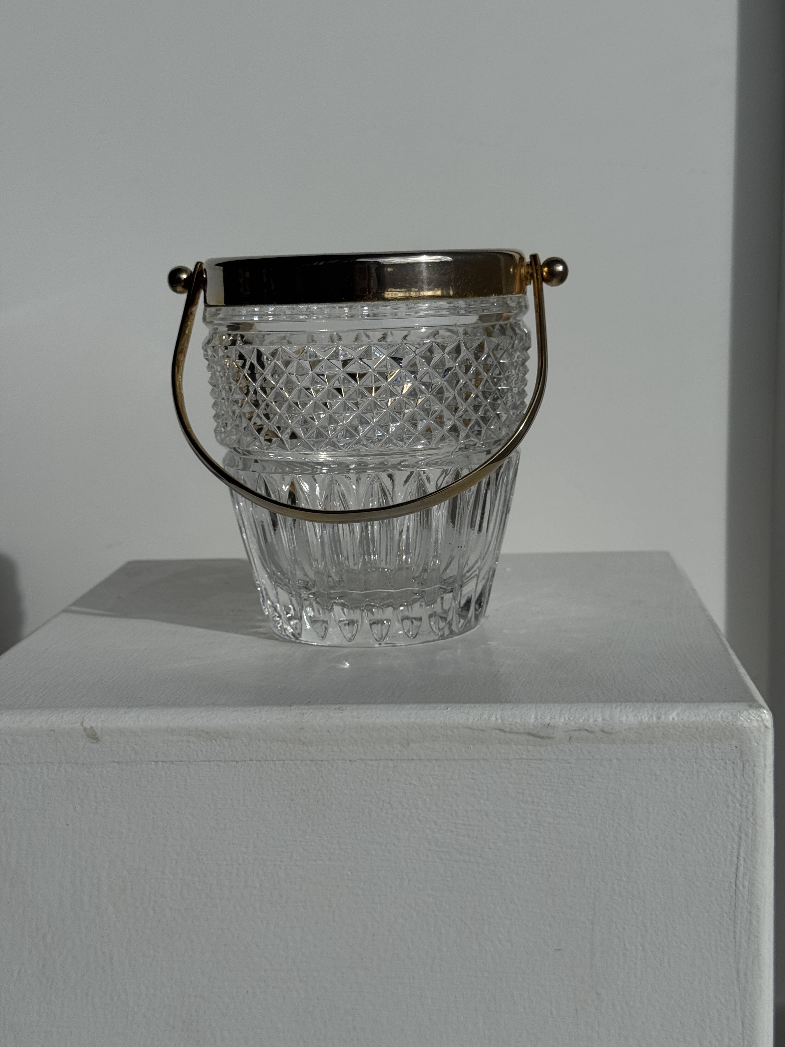 Small golden glass ice bucket with diamond point design and its scoop.