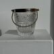 Small golden glass ice bucket with diamond point design and its scoop.