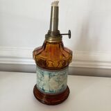Oil lamp in amber glass, early twentieth century