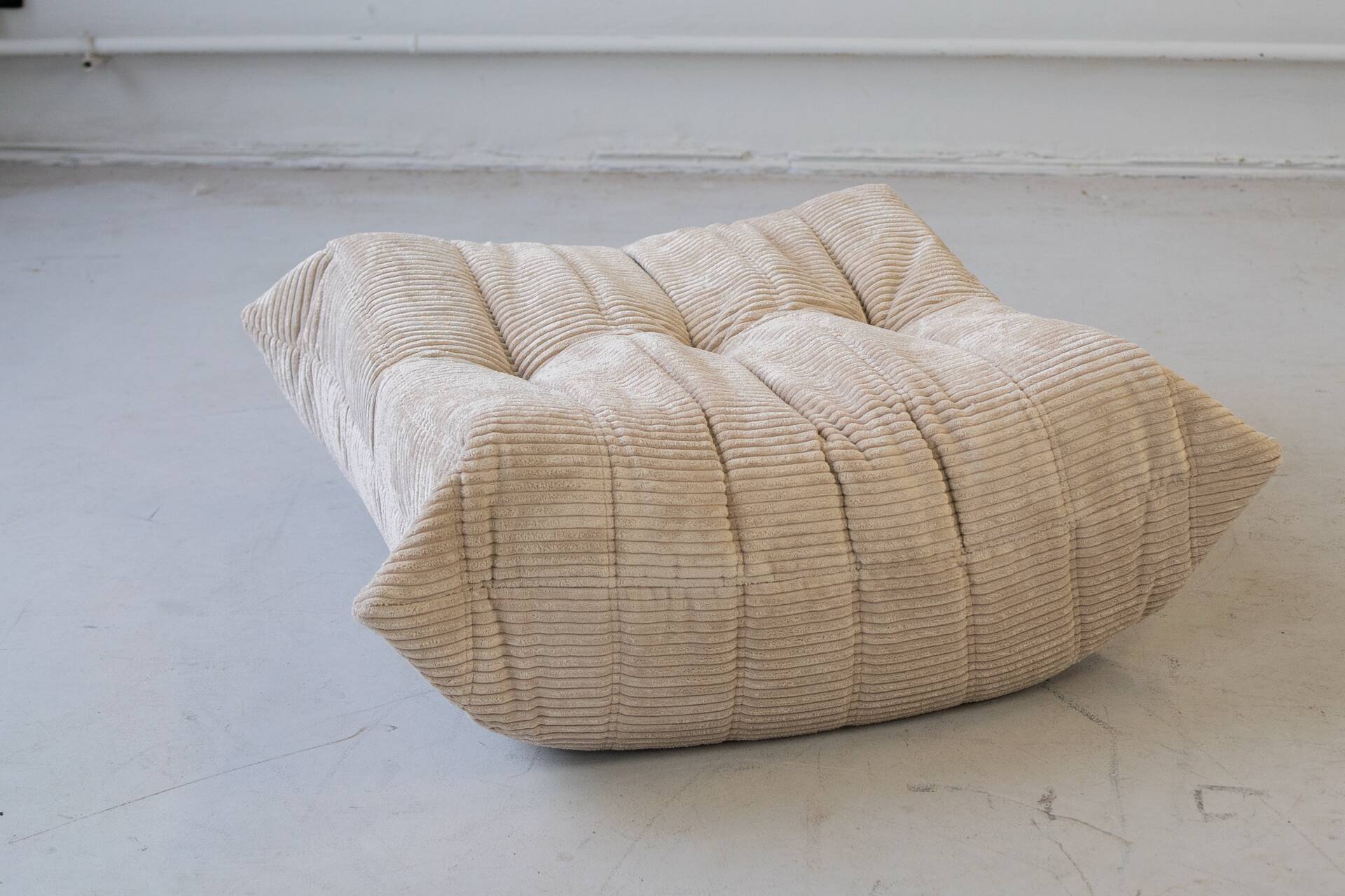 Togo set of 2 armchairs and poufne in beige corduroy