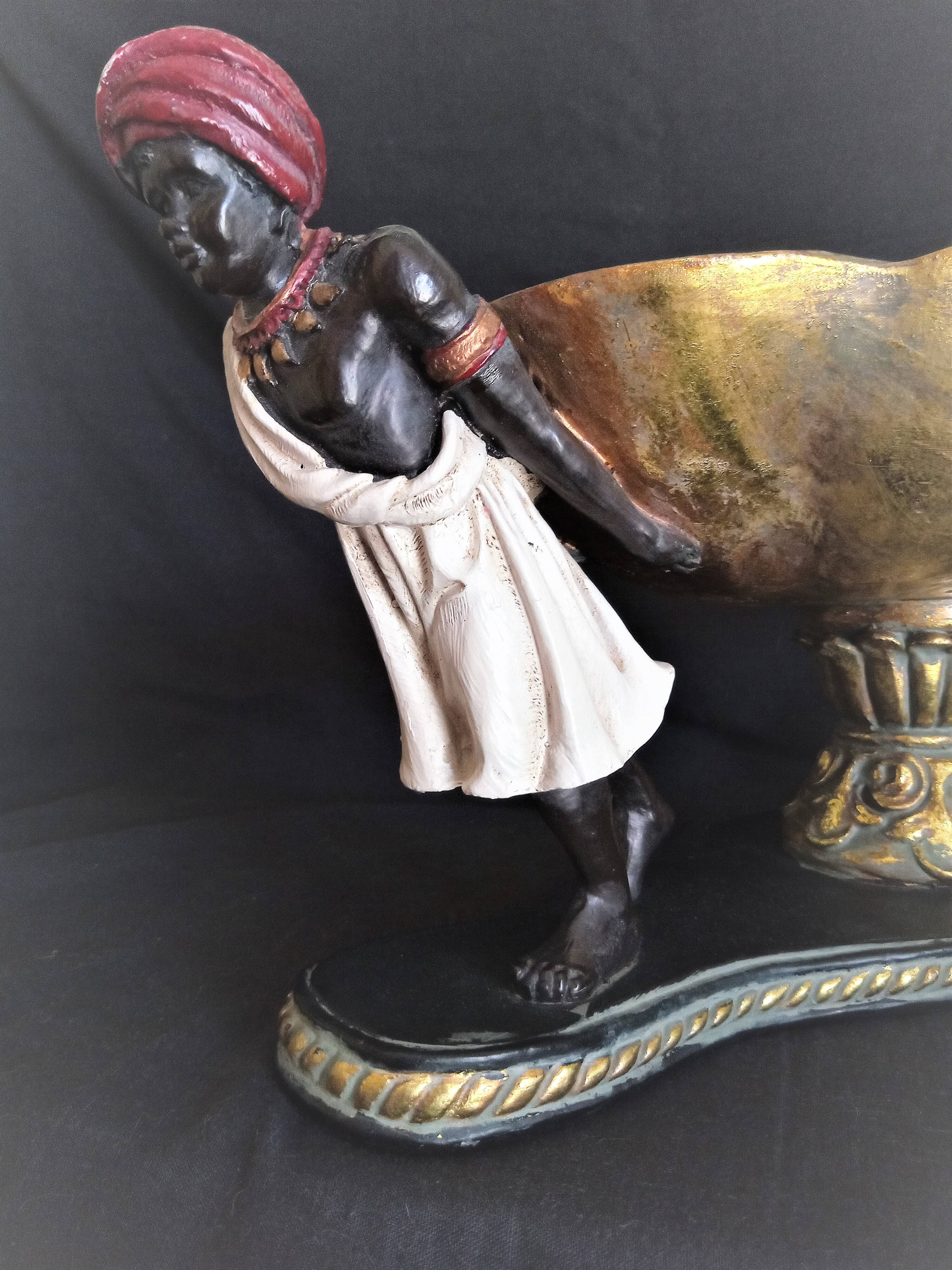 Centerpiece with African characters, plaster, resin and wood