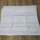 White linen towels embroidered