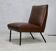 Chauffeuse, circa 1950. Simili-cuir brun.