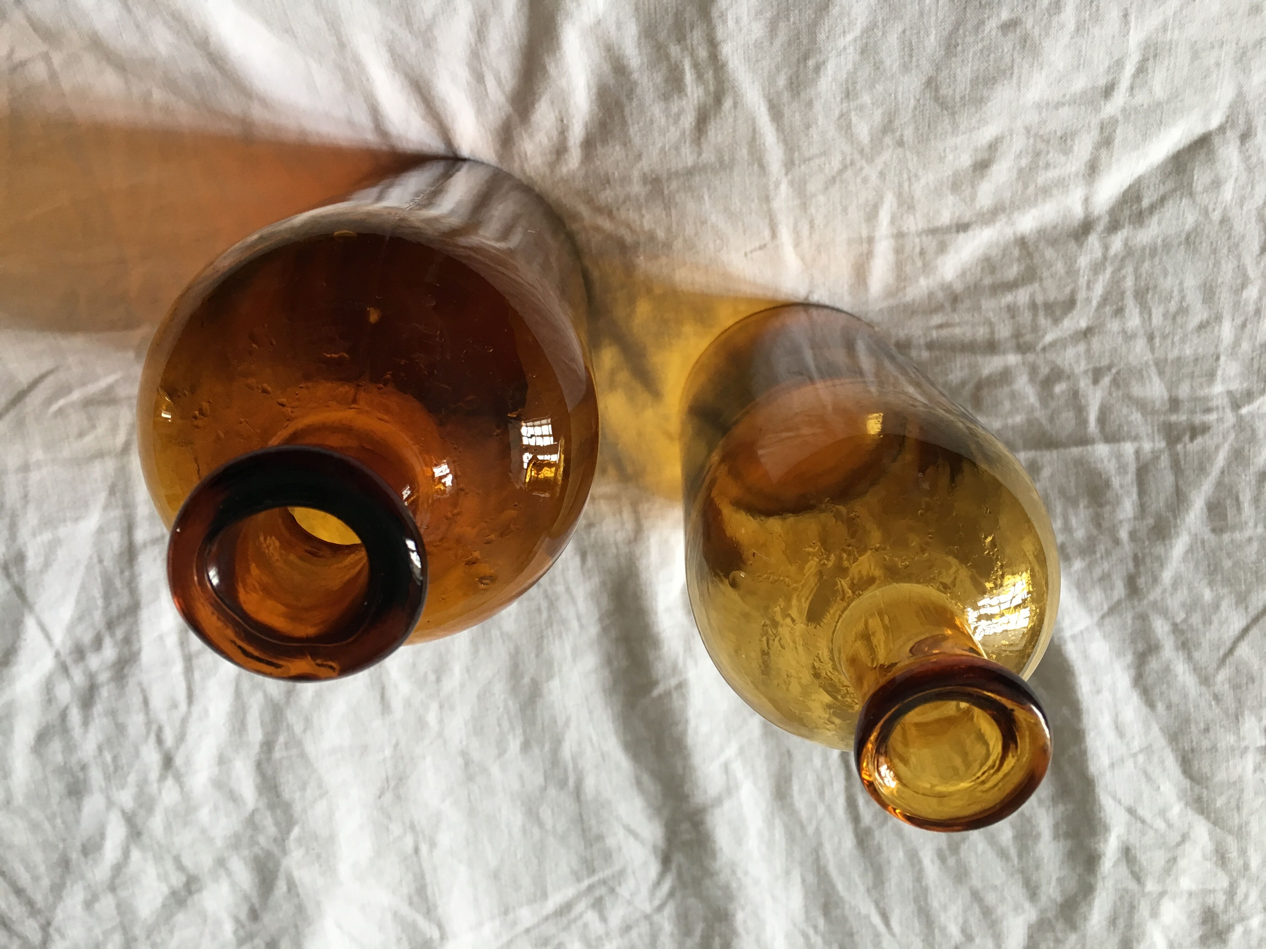 Duo of amber apothecary bottles