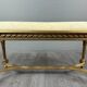 Antique gilded wooden bench in Louis XVI style, 19th century.