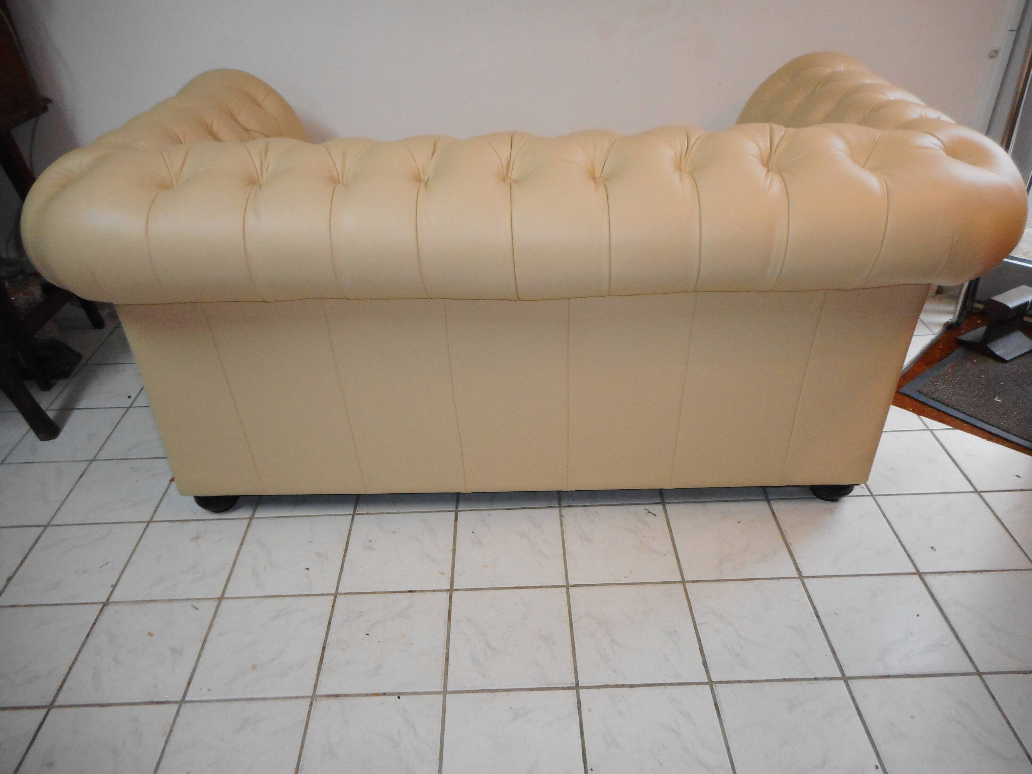 Beige leather chesterfield sofa
