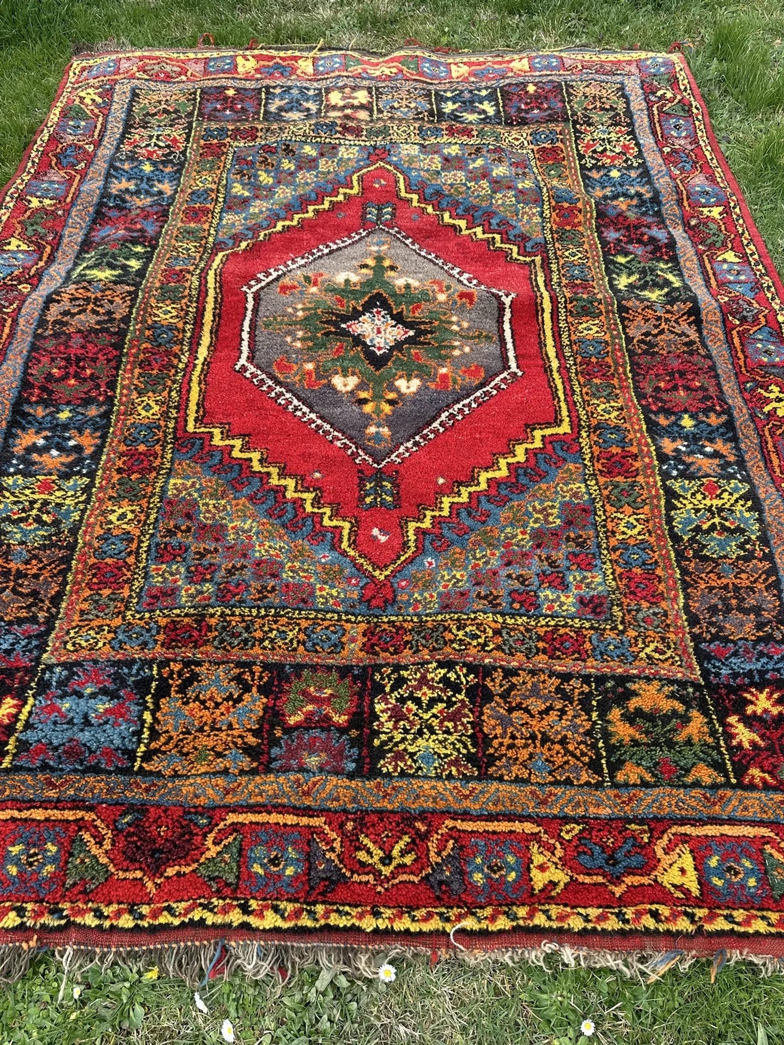 Old Moroccan carpet, made of natural wool and handwoven.