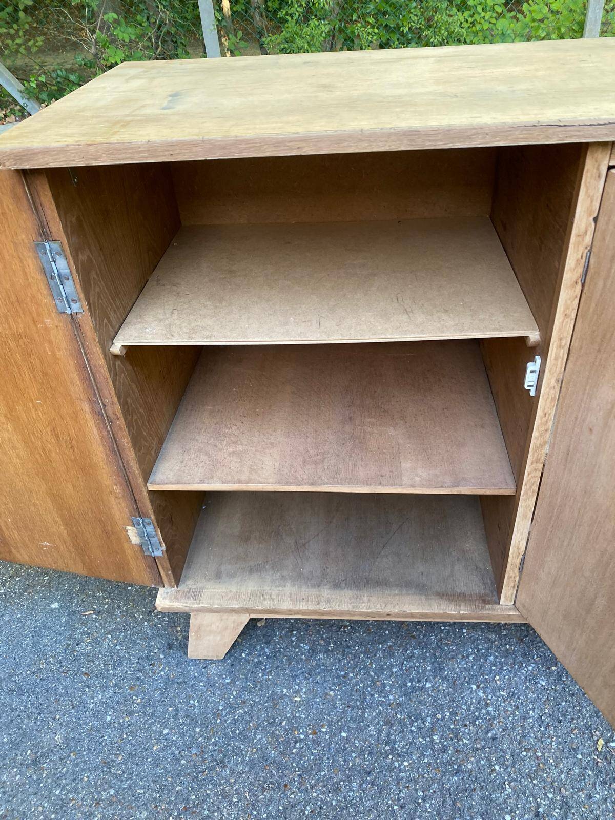 Vintage 1950s oak enfilade buffet with tapered legs.