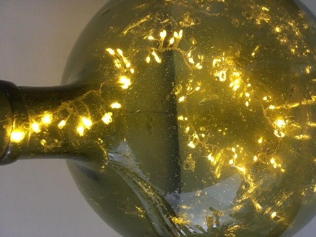 Old demijohn full of bubbles