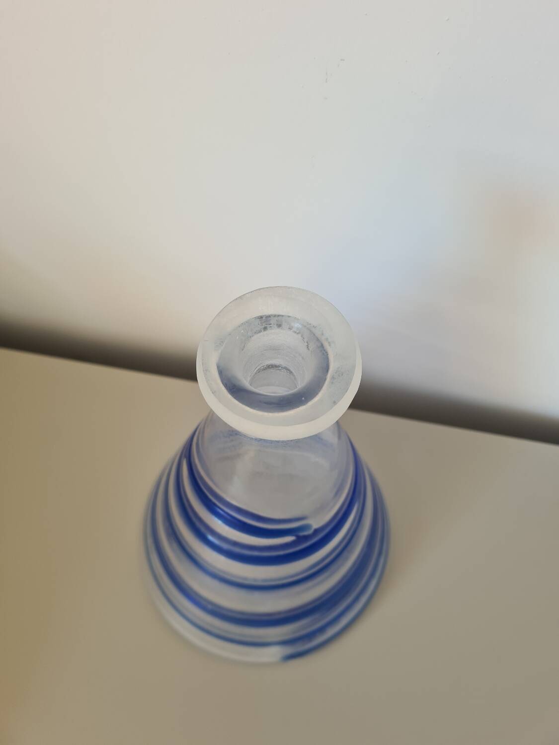 Conical glass vase/carafe blown with a blue spiral decoration.