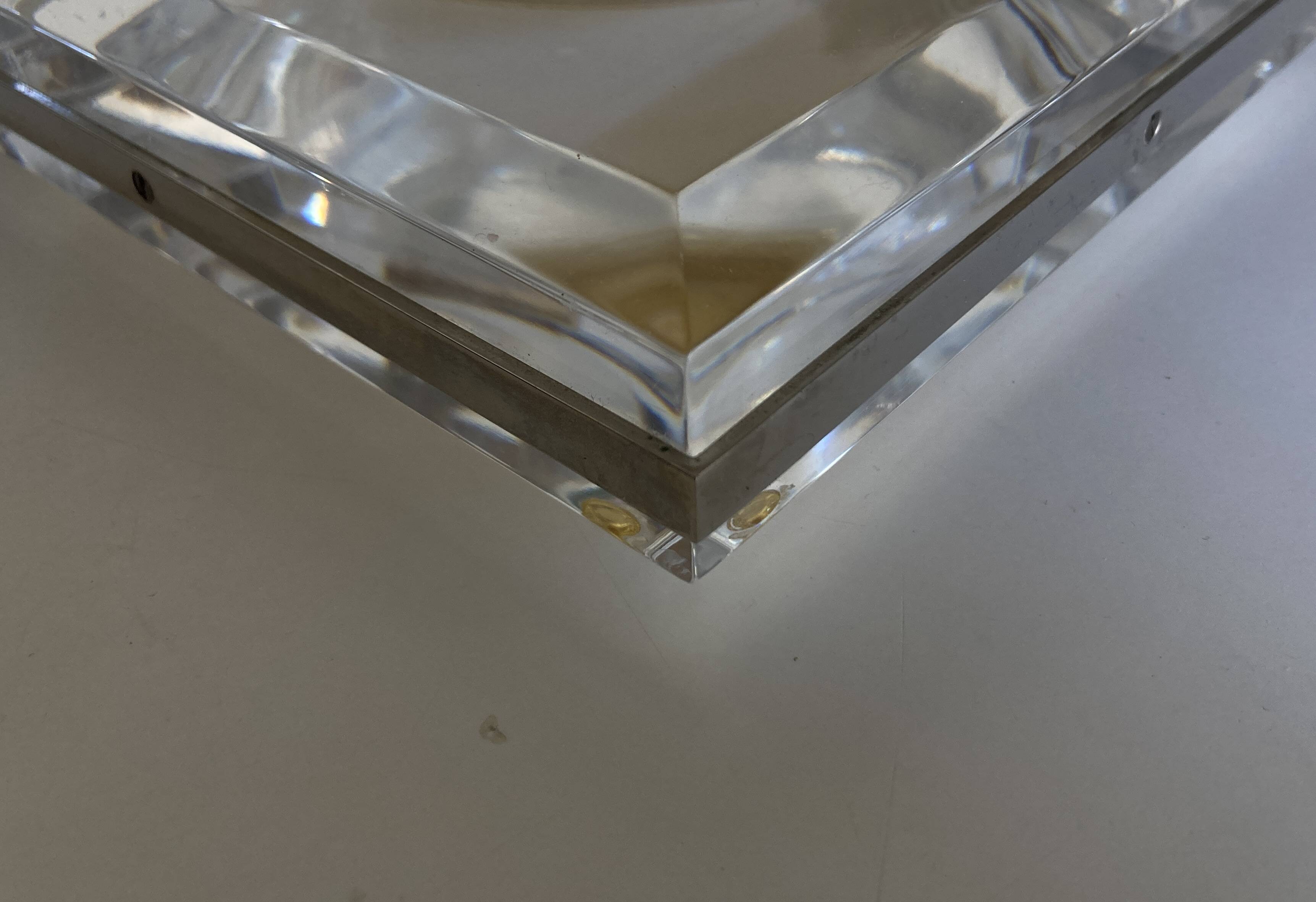 Plexiglas pocket emptier with brass and nickel silver surround, 1975, in the style of Pergay