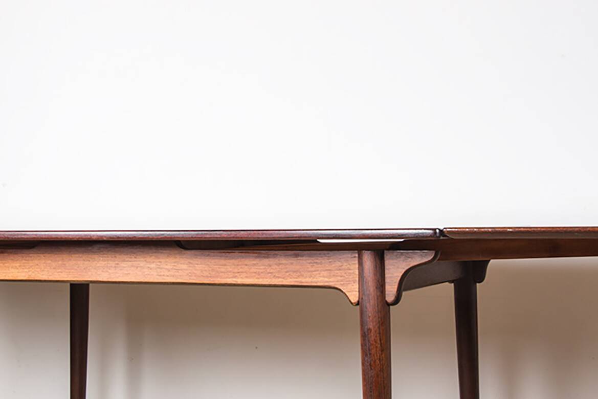 Danish extendable dining table in rosewood, model 54 by Gunni Omann