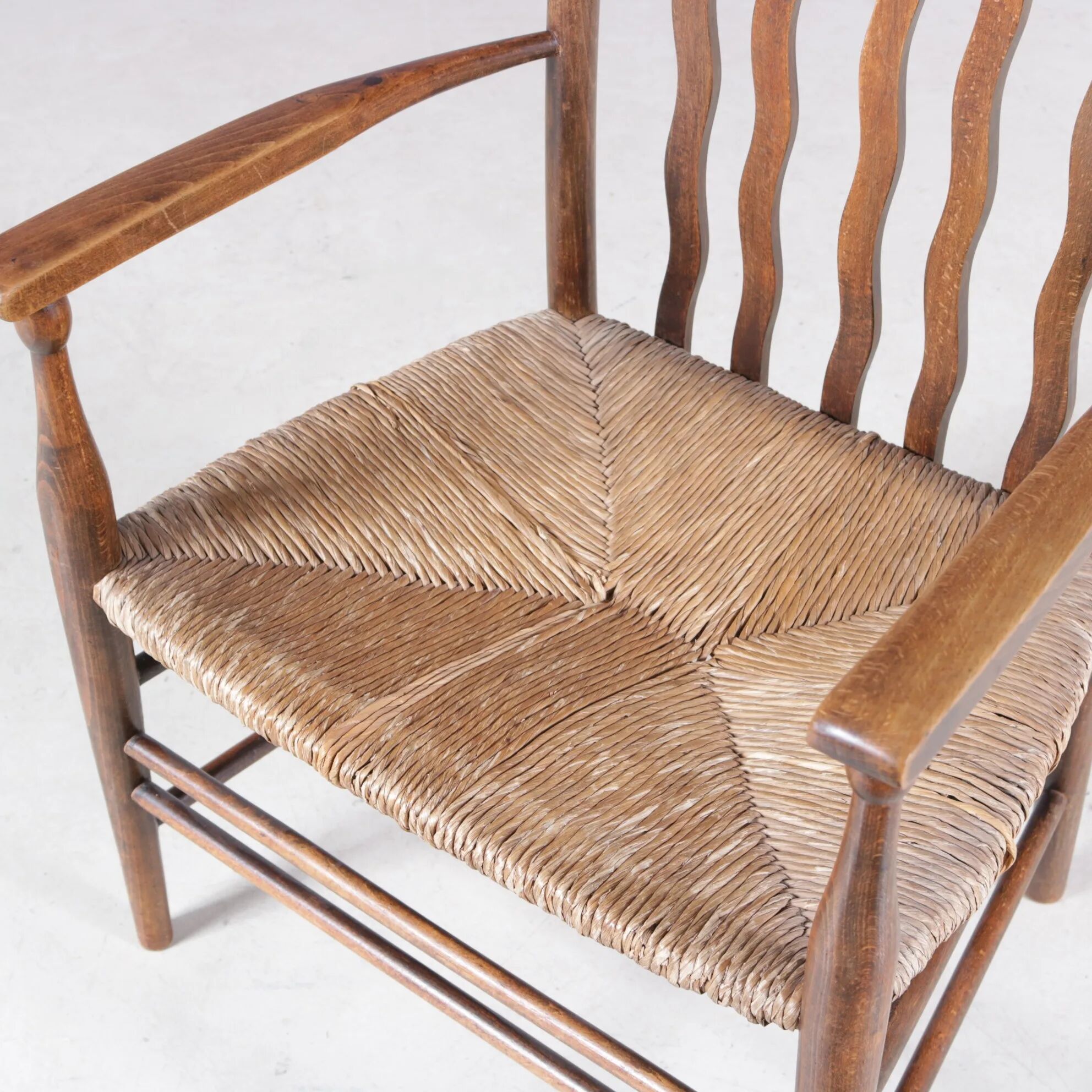 1930s small low spindle-back hearth chair / side chair with wicker seat, Arts & Craft Movement, Morris & Co for Liberty and Co, Stowaway London