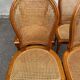 4 caned Louis XVI medallion dining chairs from the 1960s.