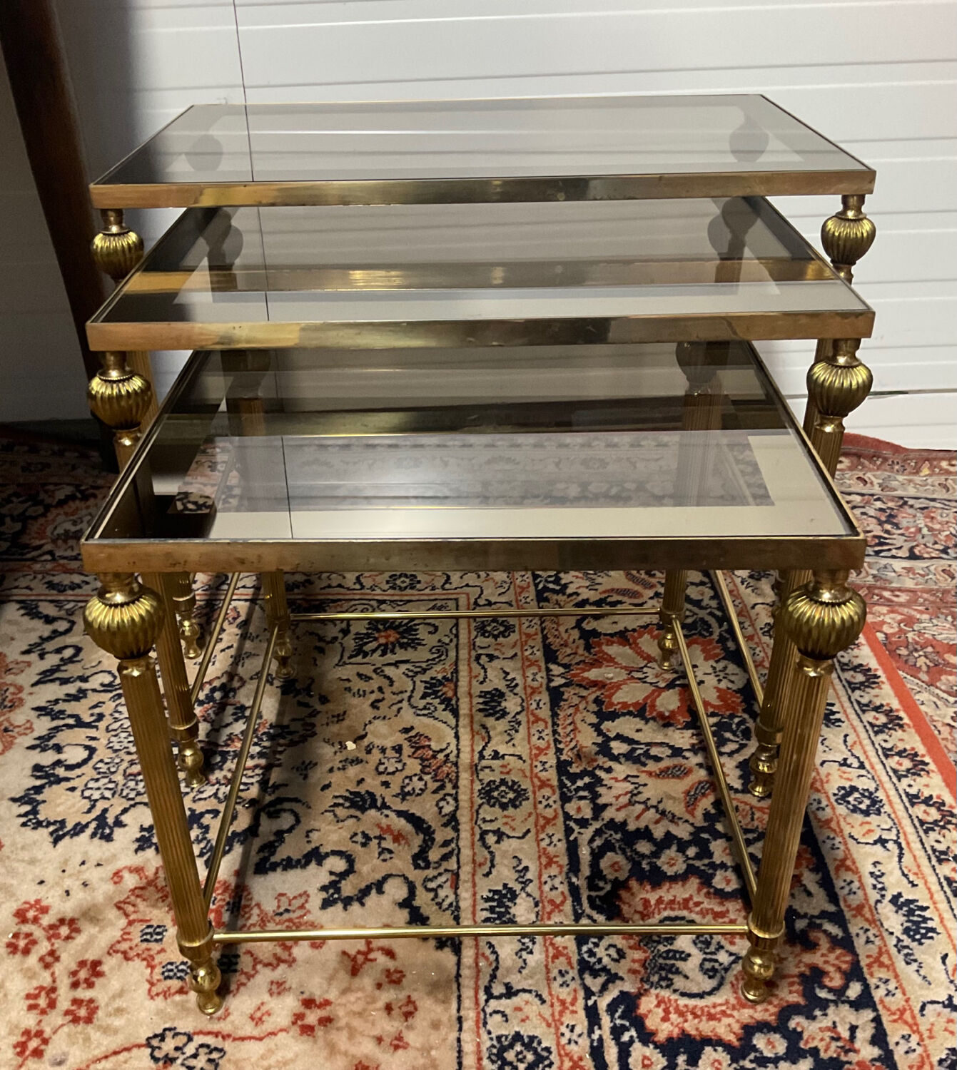 Series of 3 empire style nesting tables in brass and glass