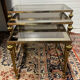 Series of 3 empire style nesting tables in brass and glass