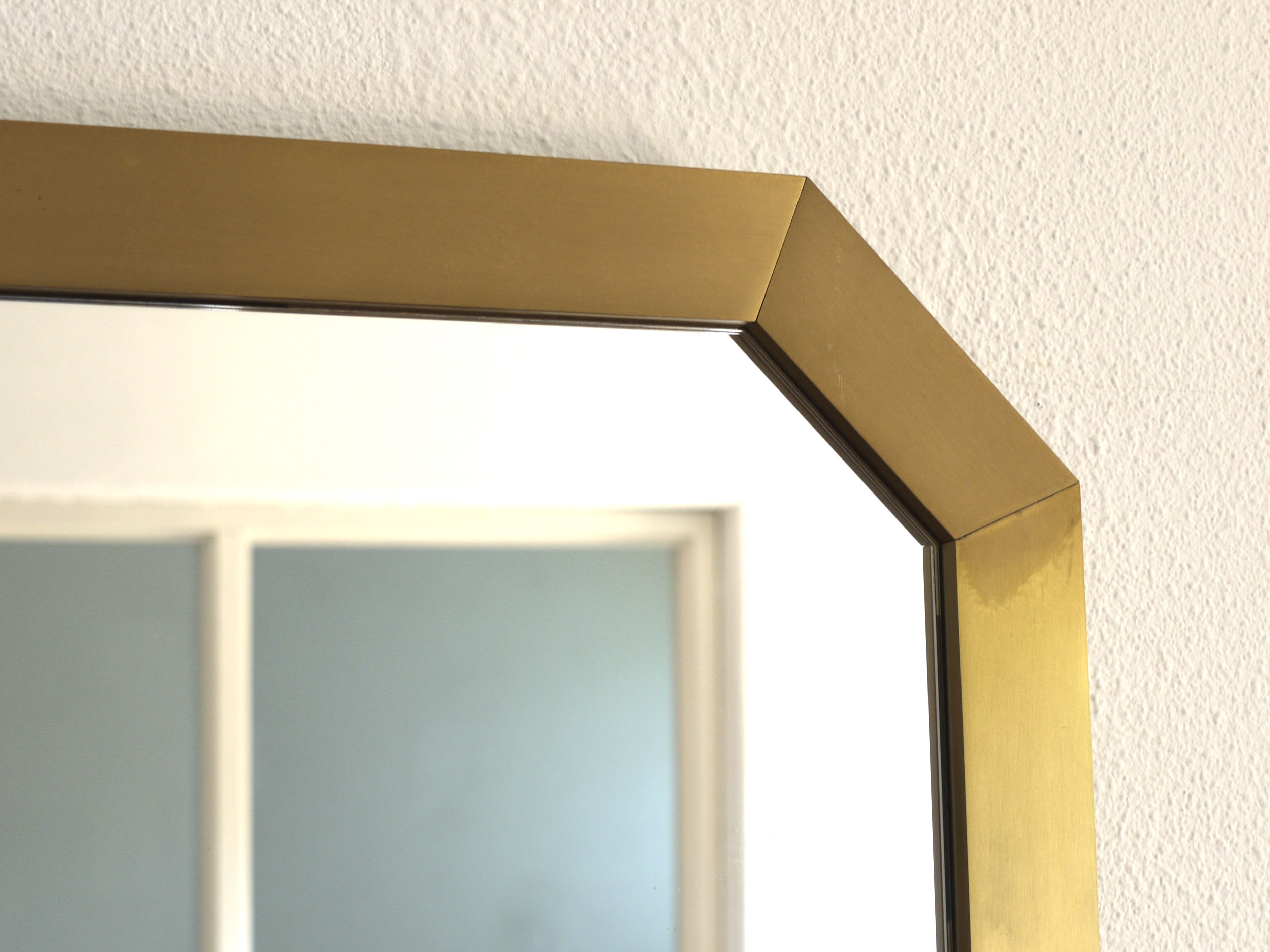 Modernist brass and glass console table & mirror. 1970s