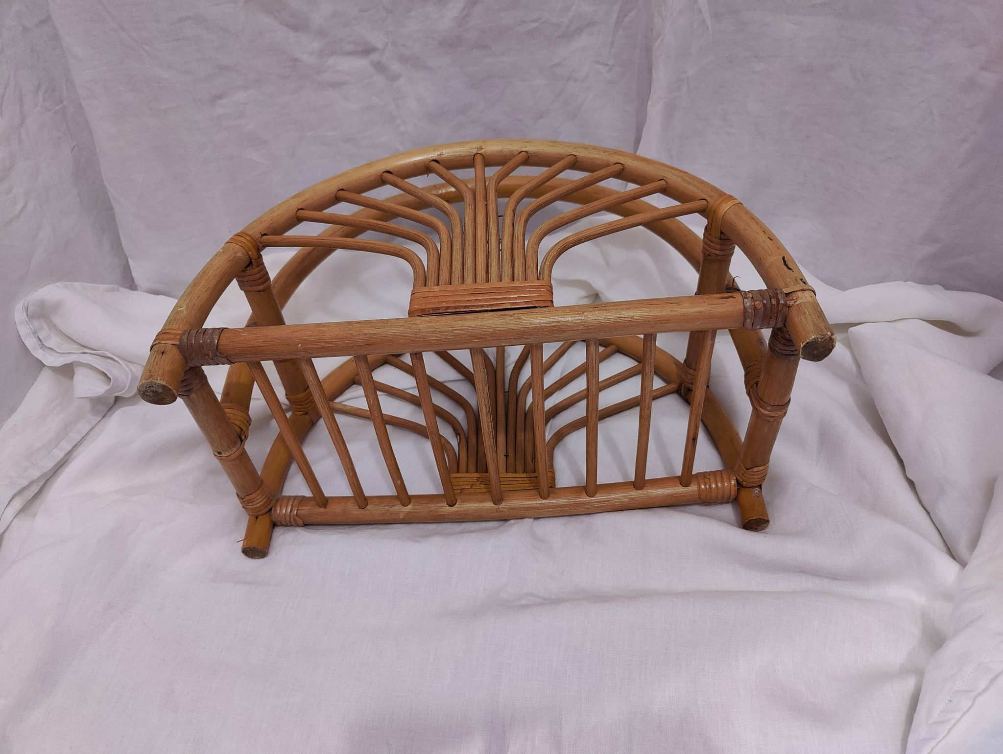 Woven bamboo magazine rack from the 1970s
