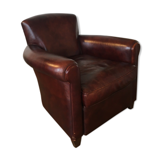 Club chair in brown leather