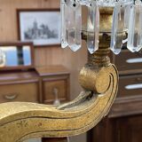 Golden wooden chandelier with crystal pendants from the 19th century.