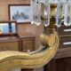 Golden wooden chandelier with crystal pendants from the 19th century.