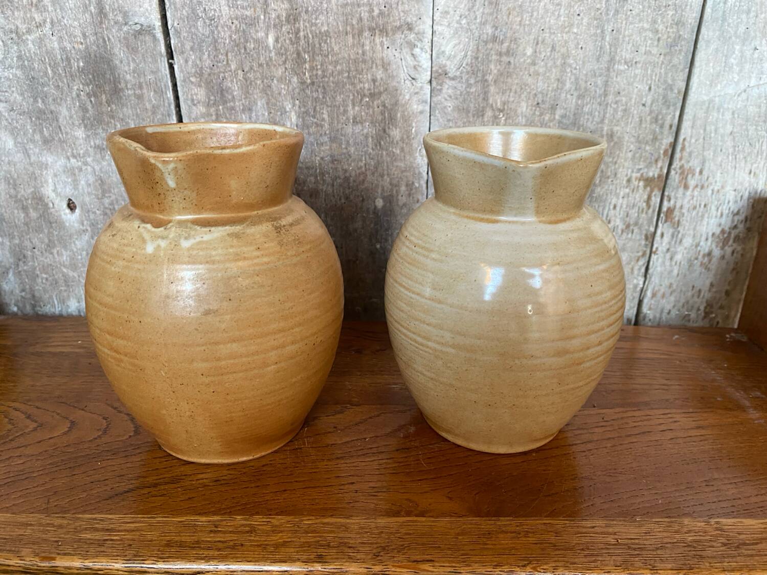 Pair antique cnp village beige & cream stoneware pitchers vintage