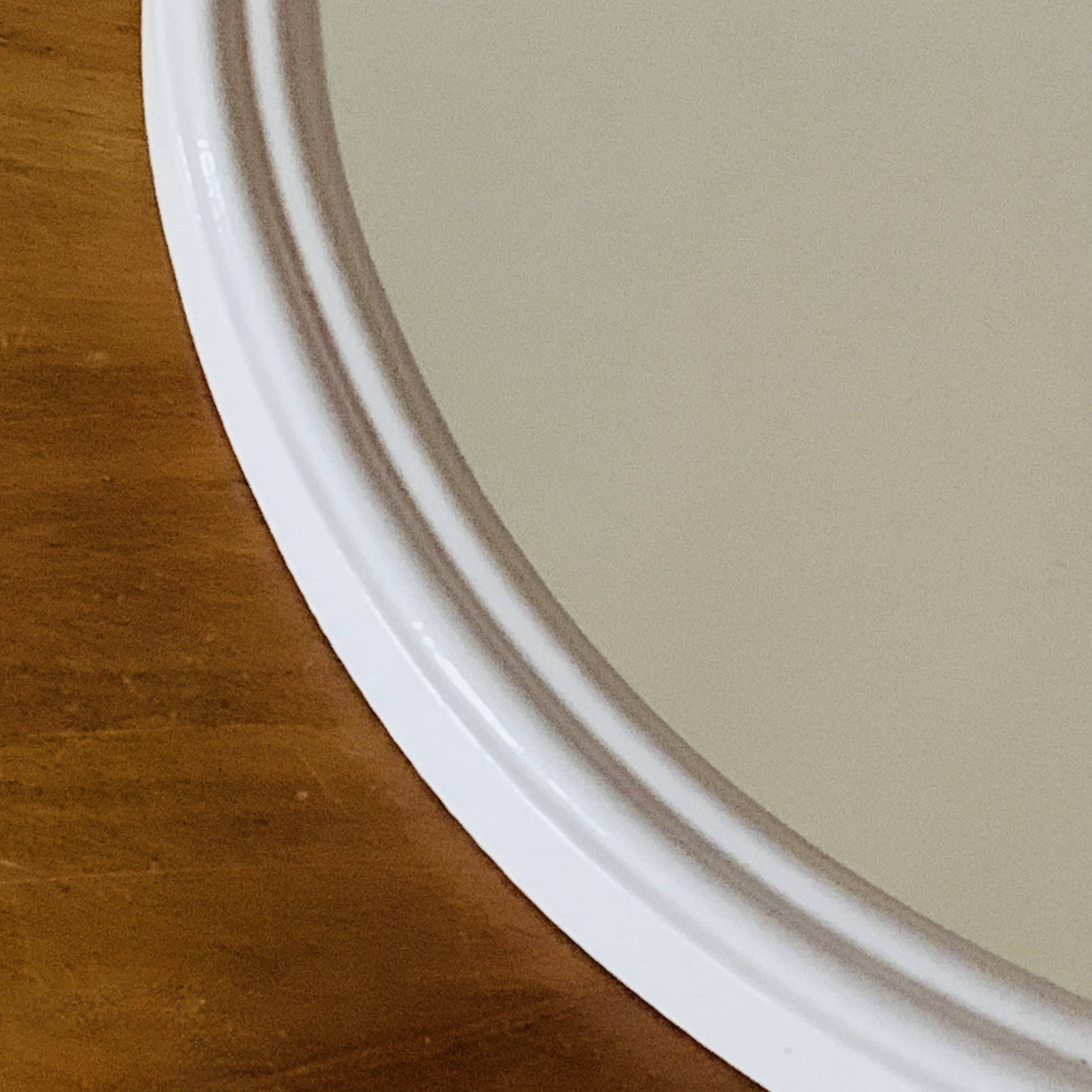 Oval mirror in vintage enameled white cast iron