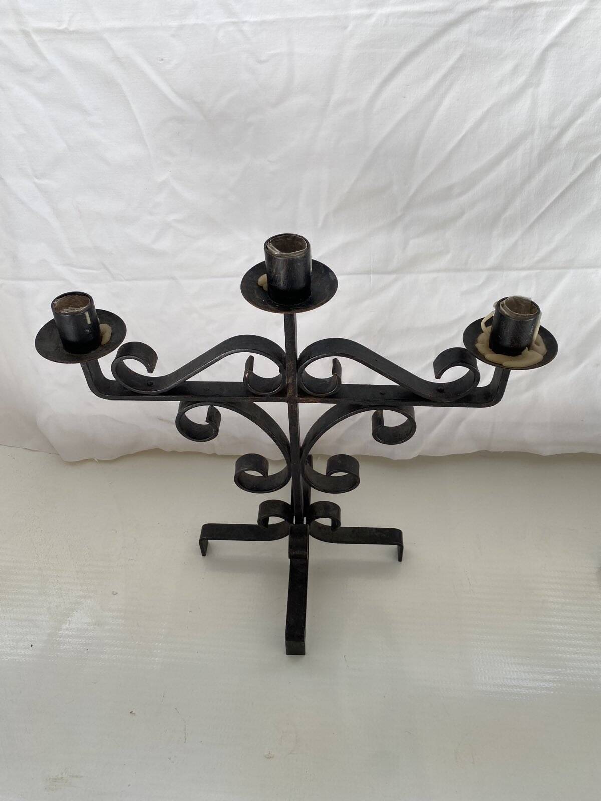 Pair of brutalist candlesticks in wrought iron