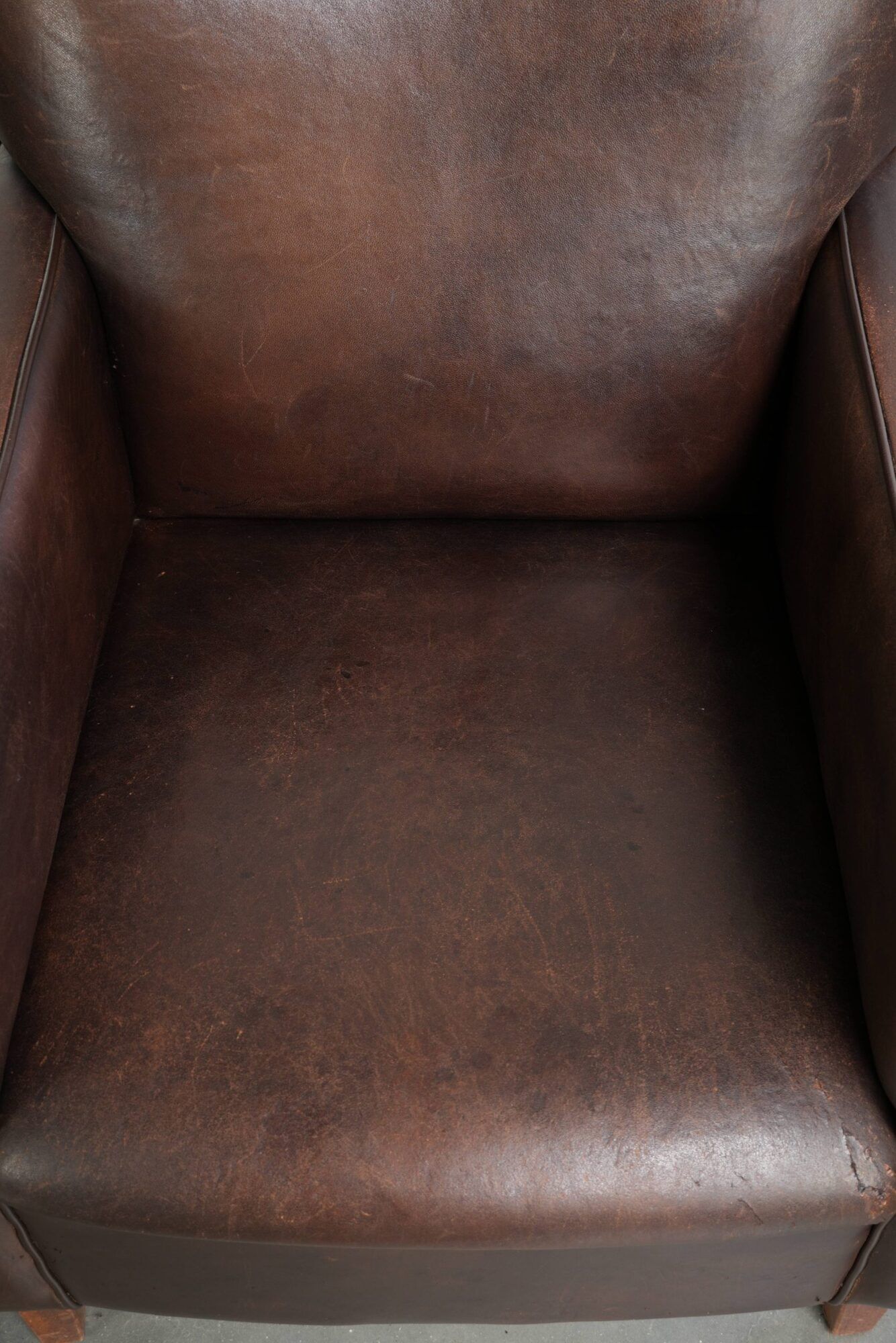 Sturdy set of vintage sheepskin armchairs in a beautiful dark colour